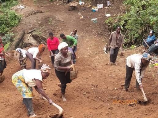 Weh people working together on a community self-help project.